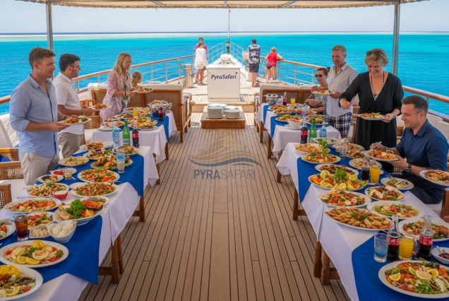 Guests enjoying gourmet buffet lunch on a luxury snorkeling boat from Sharm El Sheikh.