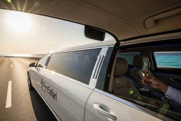 VIP limo service Sharm El Sheikh Stretch limousine driving along Naama Bay coast.